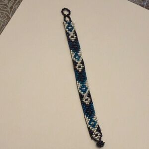 Beaded Bracelet with Blue and White Floral Design